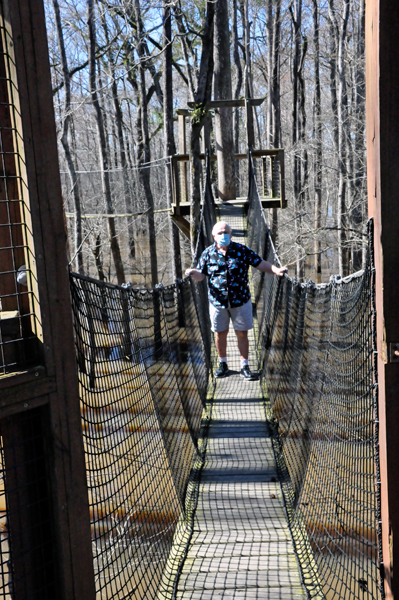 Lee Duquette on the tree-top canopy wal